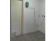 Functional utility room with tile flooring and convenient utility connections at 100 Heatherwood Blvd, Lake Wales, FL 33859