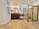 Bathroom view with glass enclosed shower, granite topped vanity, and modern fixtures at 1055 Lena Run Ct, Winter Haven, FL 33880