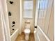 Bathroom featuring a shower-tub combination, toilet and neutral tile flooring at 1055 Lena Run Ct, Winter Haven, FL 33880