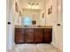 Bathroom features a double sink vanity and granite countertop at 1055 Lena Run Ct, Winter Haven, FL 33880