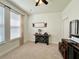 Bedroom with carpeted floor, window, and decorative furnishings at 1055 Lena Run Ct, Winter Haven, FL 33880