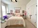 Cozy bedroom featuring a comfortable bed, plush carpets, and a spacious closet at 1055 Lena Run Ct, Winter Haven, FL 33880