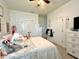 Cozy bedroom featuring a comfortable bed, plush carpets, and a spacious closet at 1055 Lena Run Ct, Winter Haven, FL 33880