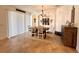 Bright dining room featuring large window, decor, and tile flooring at 1055 Lena Run Ct, Winter Haven, FL 33880