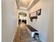 Hallway features archway, decorative rug, and a bench with a storage for an inviting and organized space at 1055 Lena Run Ct, Winter Haven, FL 33880