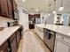Kitchen featuring a large island with a sink, stainless steel appliances, and cabinetry at 1055 Lena Run Ct, Winter Haven, FL 33880