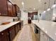 Kitchen featuring a large island with a sink, stainless steel appliances, and cabinetry at 1055 Lena Run Ct, Winter Haven, FL 33880