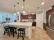 Bright kitchen with white countertops, stainless steel appliances, ample cabinetry, and an island with seating at 1055 Lena Run Ct, Winter Haven, FL 33880