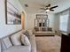 Relaxing living room boasts a modern ceiling fan, neutral furniture, and stylish decor at 1055 Lena Run Ct, Winter Haven, FL 33880