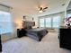 Spacious main bedroom with lots of natural light and carpet flooring at 1055 Lena Run Ct, Winter Haven, FL 33880