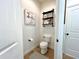 Toilet room with decorative shelf and tile floor at 1055 Lena Run Ct, Winter Haven, FL 33880