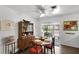 Cozy dining room featuring a ceiling fan, sliding glass doors, and classic wood furniture at 136 Hampden Rd, Winter Haven, FL 33884