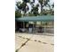 View of the metal carport featuring concrete slab and grill at 1405 N Lake Reedy Blvd, Frostproof, FL 33843