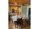 Dining room connected to kitchen, showcasing wooden table with four chairs at 1405 N Lake Reedy Blvd, Frostproof, FL 33843