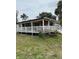 Charming single-story home with a covered front porch and white railing at 1405 N Lake Reedy Blvd, Frostproof, FL 33843