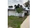 Charming home featuring white picket fence and partially covered porch at 1405 N Lake Reedy Blvd, Frostproof, FL 33843