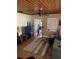 Inviting living room with hardwood floors, a comfortable sofa, and a wood-look ceiling at 1405 N Lake Reedy Blvd, Frostproof, FL 33843