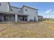 Back exterior of home featuring a covered patio at 141 Claire Ln, Davenport, FL 33837