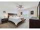 Bright bedroom with a ceiling fan, carpeted floor, and contemporary furniture at 141 Claire Ln, Davenport, FL 33837