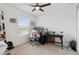 Cozy bedroom with a computer desk, rolling chair, and a view from the window at 141 Claire Ln, Davenport, FL 33837