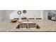 Close up view of a kitchen island with granite countertop, double sink, faucet, and dark cabinets at 141 Claire Ln, Davenport, FL 33837