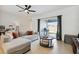 Comfortable living room with modern decor and view of the patio at 141 Claire Ln, Davenport, FL 33837