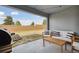 Relaxing outdoor patio space with furniture and a grill overlooking the backyard at 141 Claire Ln, Davenport, FL 33837