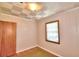 Bedroom featuring wood-look flooring, panelled walls, and a window at 1475 S Lake Howard Dr, Winter Haven, FL 33880