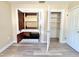 This bedroom features two closets, light gray flooring, and neutral paint at 1819 4Th Se Ct, Winter Haven, FL 33880