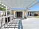 Outdoor deck and pergola leading to sunroom entrance, creating seamless indoor-outdoor living at 1819 4Th Se Ct, Winter Haven, FL 33880