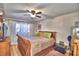 Inviting bedroom with soft natural light, ceiling fan, and plush textures for comfort at 200 El Camino Dr # 202, Winter Haven, FL 33884