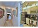 Kitchen with tile floors, stainless steel appliances, and lots of storage space at 200 El Camino Dr # 202, Winter Haven, FL 33884