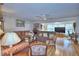 Bright living room with hardwood floors, offering plenty of natural light and a cozy atmosphere at 200 El Camino Dr # 202, Winter Haven, FL 33884