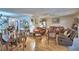 Spacious open-concept living room with hardwood floors and comfortable seating areas at 200 El Camino Dr # 202, Winter Haven, FL 33884