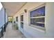 Apartment patio featuring outdoor seating and entrance door at 200 El Camino Dr # 202, Winter Haven, FL 33884