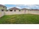 Spacious backyard with a well-maintained lawn and a privacy fence at 2005 Carnostie Rd, Winter Haven, FL 33884