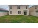 Grassy backyard featuring a covered patio and new vinyl fence for outdoor enjoyment at 2005 Carnostie Rd, Winter Haven, FL 33884