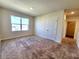 Bedroom with a view from window, closet, and neutral paint color at 2005 Carnostie Rd, Winter Haven, FL 33884