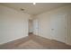 An inviting bedroom featuring neutral carpeting, a walk-in closet, and a bright, airy ambiance at 2005 Carnostie Rd, Winter Haven, FL 33884