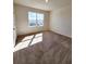 Carpeted bedroom featuring a window overlooking the neighborhood at 2005 Carnostie Rd, Winter Haven, FL 33884