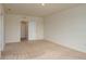 Spacious bedroom featuring neutral carpet, white walls, and a walk-in closet at 2005 Carnostie Rd, Winter Haven, FL 33884