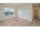 Bright bedroom featuring neutral walls, cozy carpet, and a window providing natural light at 2005 Carnostie Rd, Winter Haven, FL 33884
