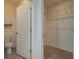 Walk-in closet with installed wire shelving for optimal storage solutions at 2005 Carnostie Rd, Winter Haven, FL 33884