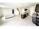 Open-concept living space featuring a modern kitchen, a staircase, tile flooring, and bright lighting at 2005 Carnostie Rd, Winter Haven, FL 33884