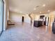 Open-concept living space featuring a modern kitchen, a staircase, tile flooring, and bright lighting at 2005 Carnostie Rd, Winter Haven, FL 33884