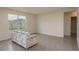 Comfortable living room with neutral walls and large windows providing lots of natural light and a comfortable sofa at 2005 Carnostie Rd, Winter Haven, FL 33884