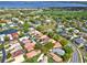 Aerial view of a charming community with lush landscaping and views of The Country Club of Winter Haven at 208 Lake Region S Blvd, Winter Haven, FL 33881