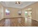 Bright bedroom features tile floors, tray ceilings, and sliding glass door to screened patio at 208 Lake Region S Blvd, Winter Haven, FL 33881