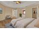 This bedroom features tray ceilings, wood floors, and access to a large walk-in closet and full bathroom at 208 Lake Region S Blvd, Winter Haven, FL 33881