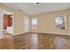 Spacious bedroom features wood-look tile flooring and three windows providing lots of natural light at 208 Lake Region S Blvd, Winter Haven, FL 33881